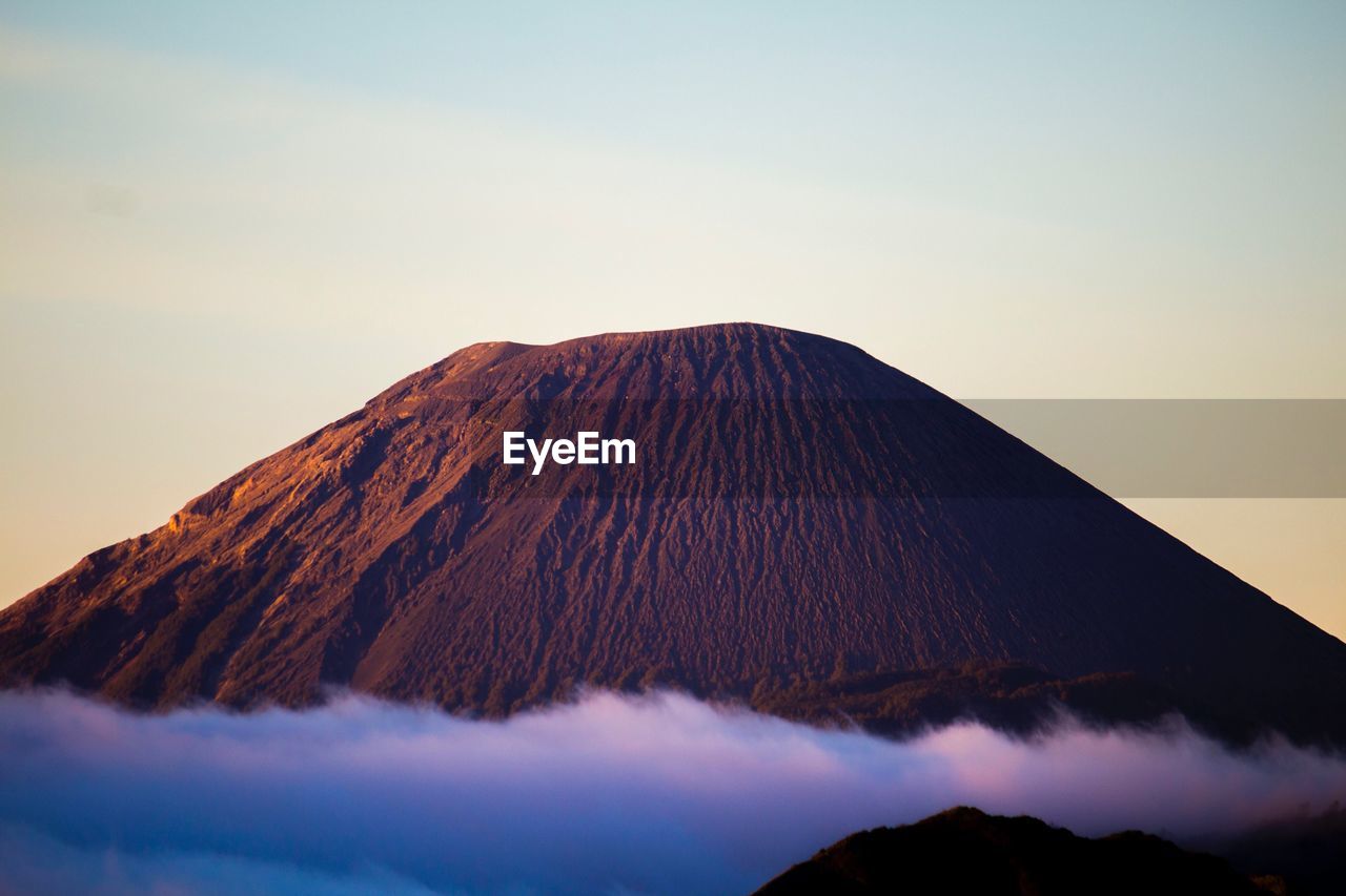 Panoramic view of volcanic mountain against clear sky