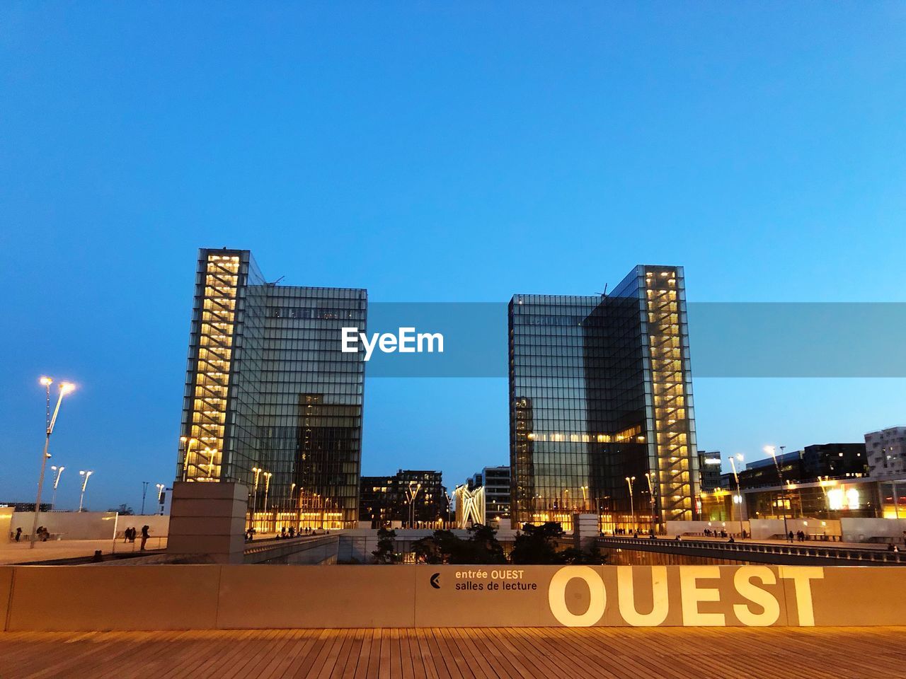 MODERN BUILDINGS AGAINST CLEAR BLUE SKY IN CITY