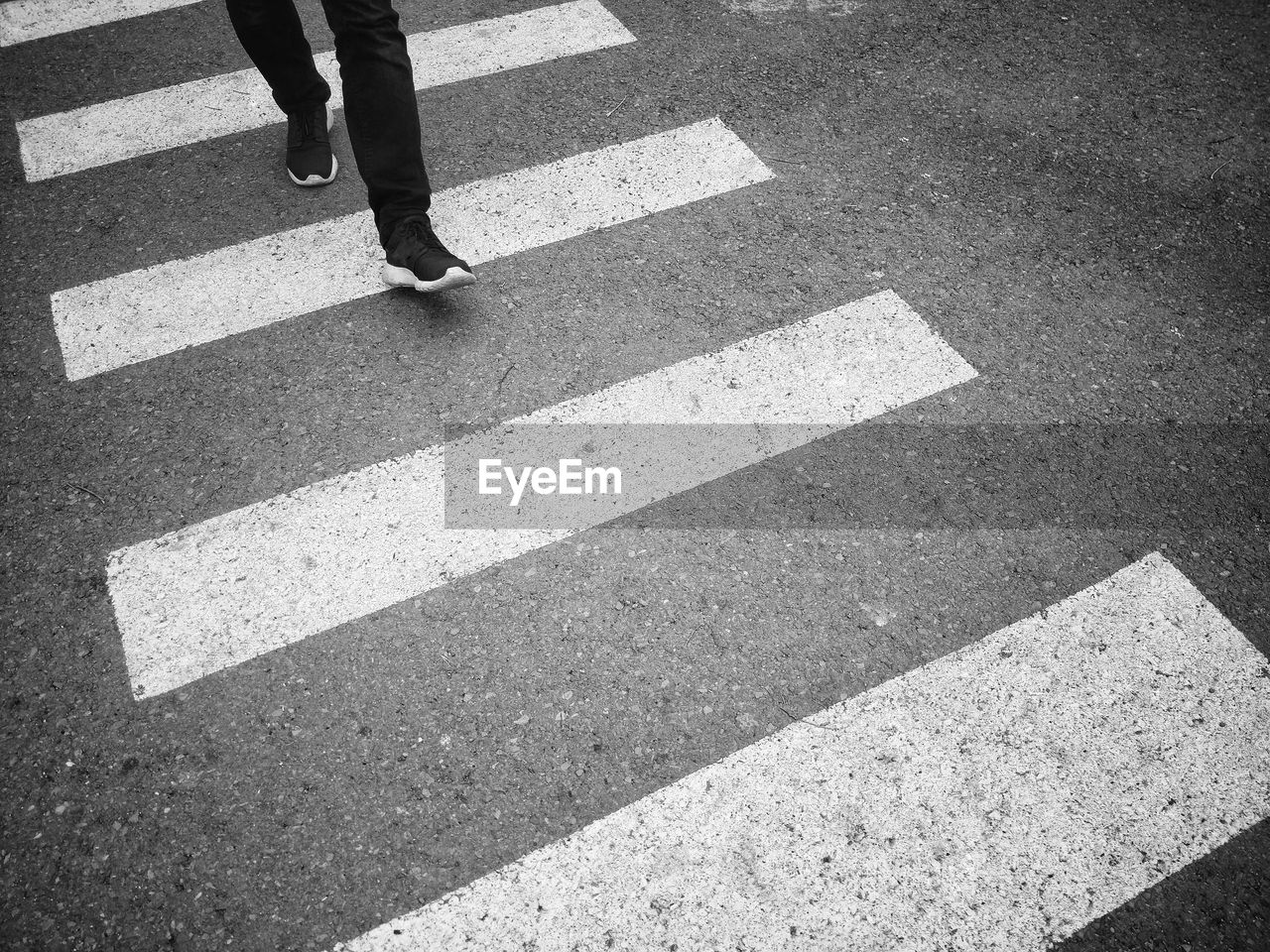 LOW SECTION OF PERSON WALKING ON STREET