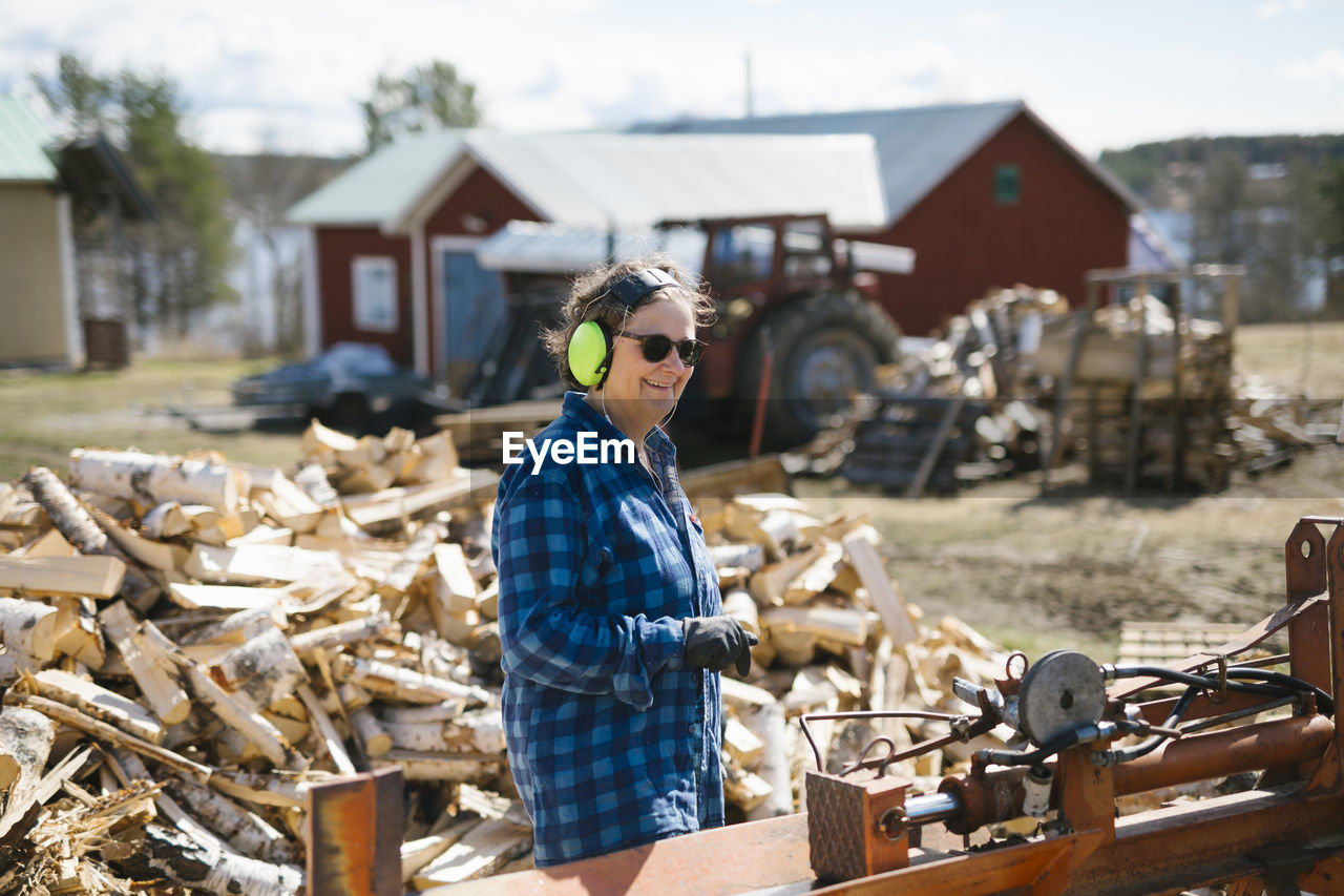 Mature woman working in sawmill