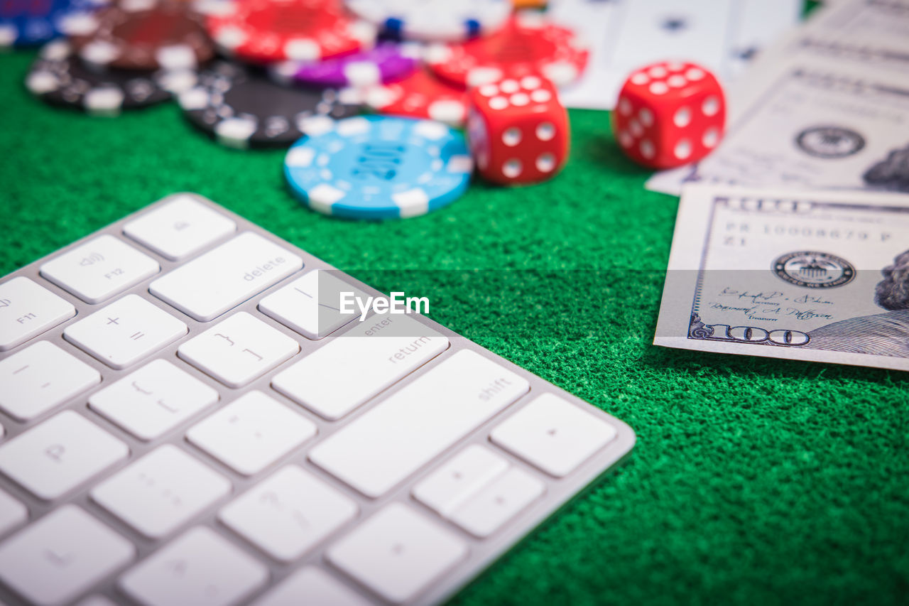 Close-up of cards and gambling chips on table