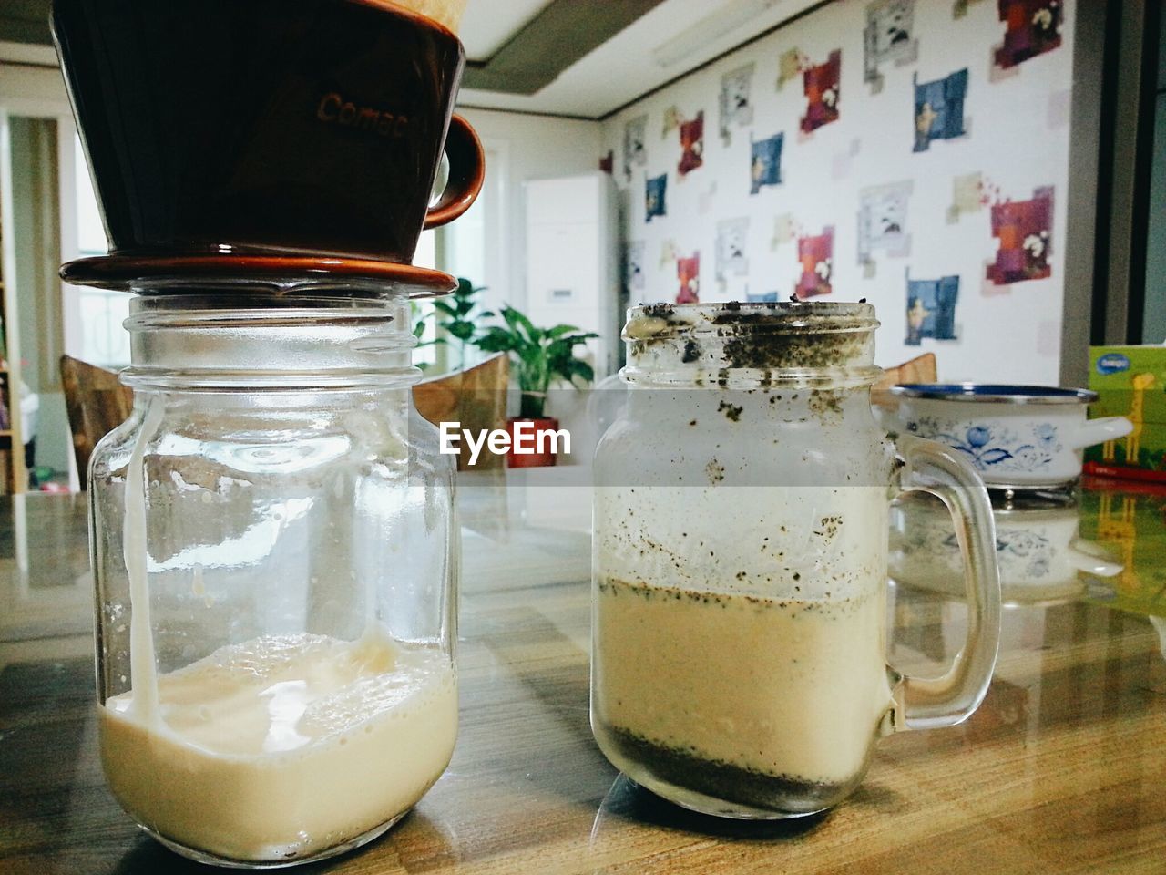 Close-up of jars of milk