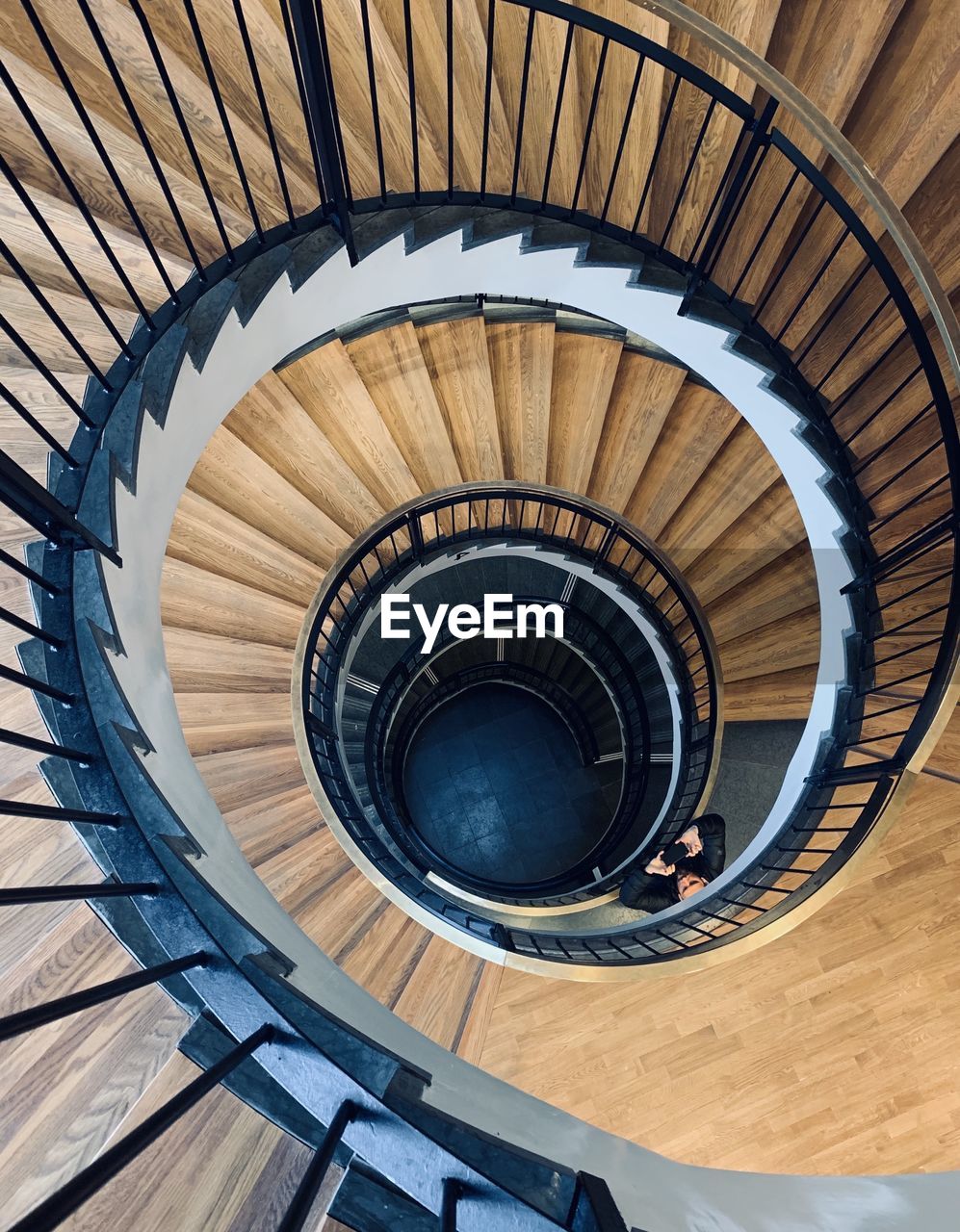 Directly below shot of spiral staircase of building