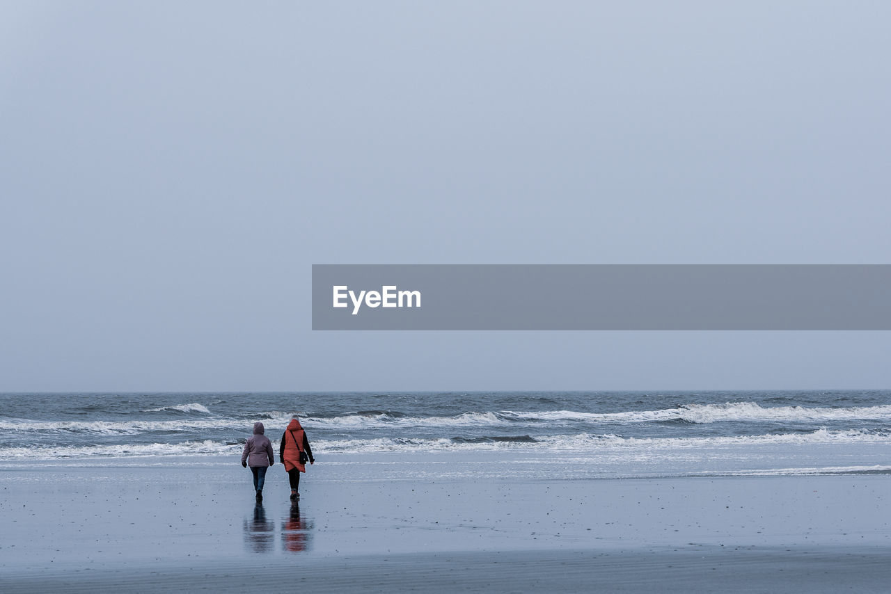 Tourists on the norsee beach of sankt peter-ording in germany