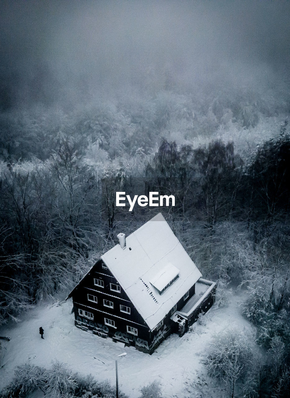 High angle view of house amidst forest