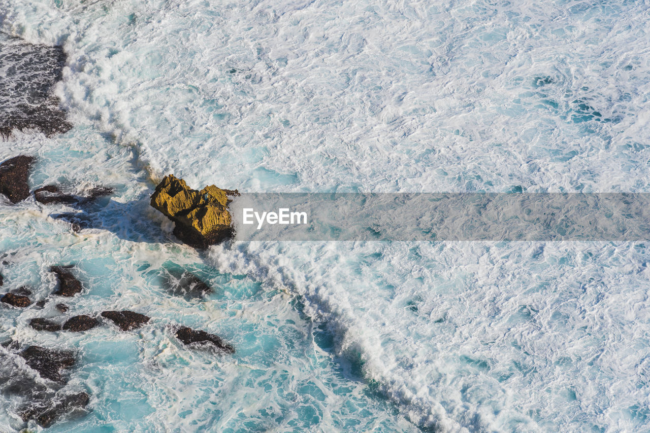 High angle view of waves in sea