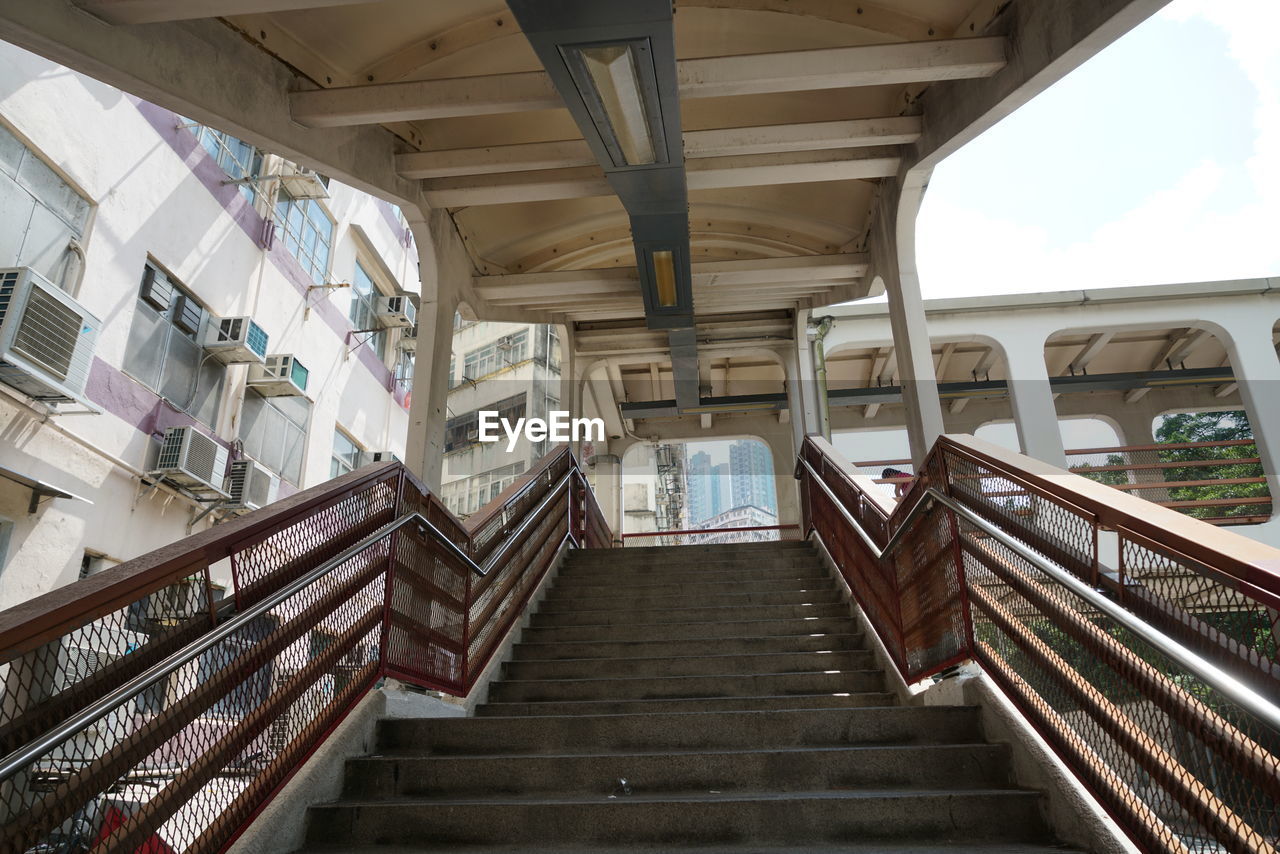 LOW ANGLE VIEW OF EMPTY STEPS IN BUILDING