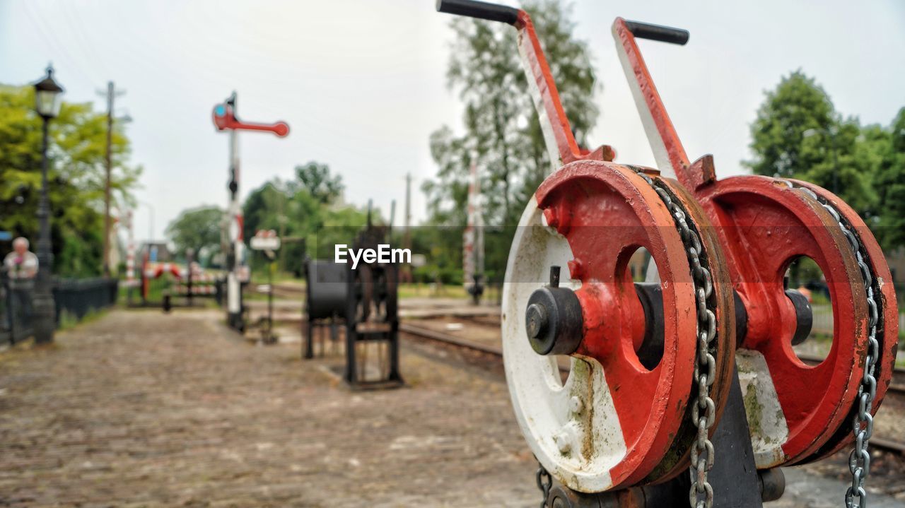 CLOSE-UP OF RED MACHINERY ON FIELD