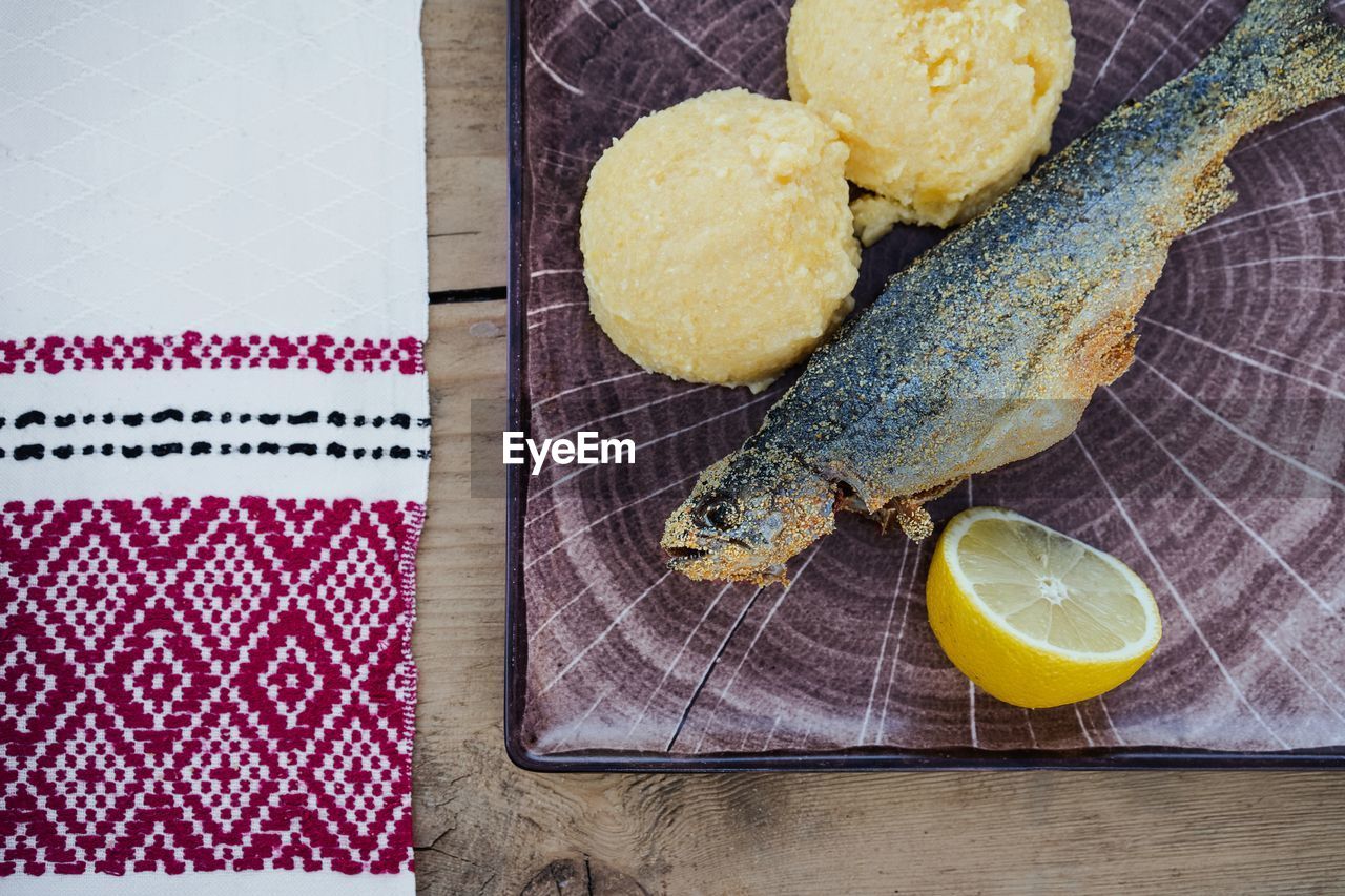 High angle view of fish in plate on table