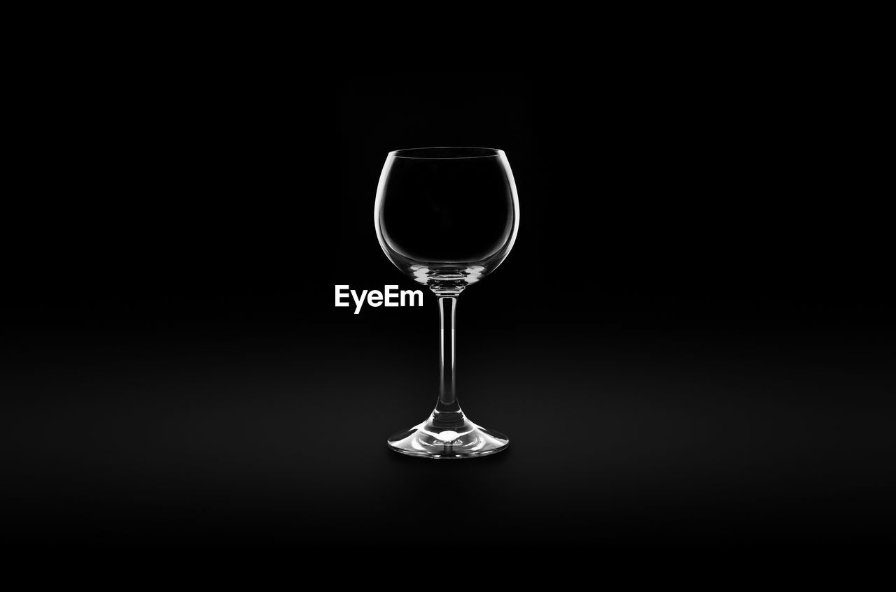 Black and white shot of a wine glass. product like shot