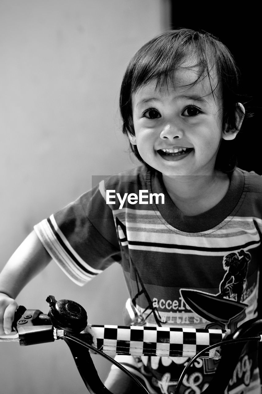 childhood, child, one person, portrait, happiness, black and white, smiling, black, emotion, monochrome, monochrome photography, looking at camera, musician, men, cheerful, white, front view, waist up, cute, indoors, music, person, fun, enjoyment, lifestyles, arts culture and entertainment, musical instrument, female, casual clothing