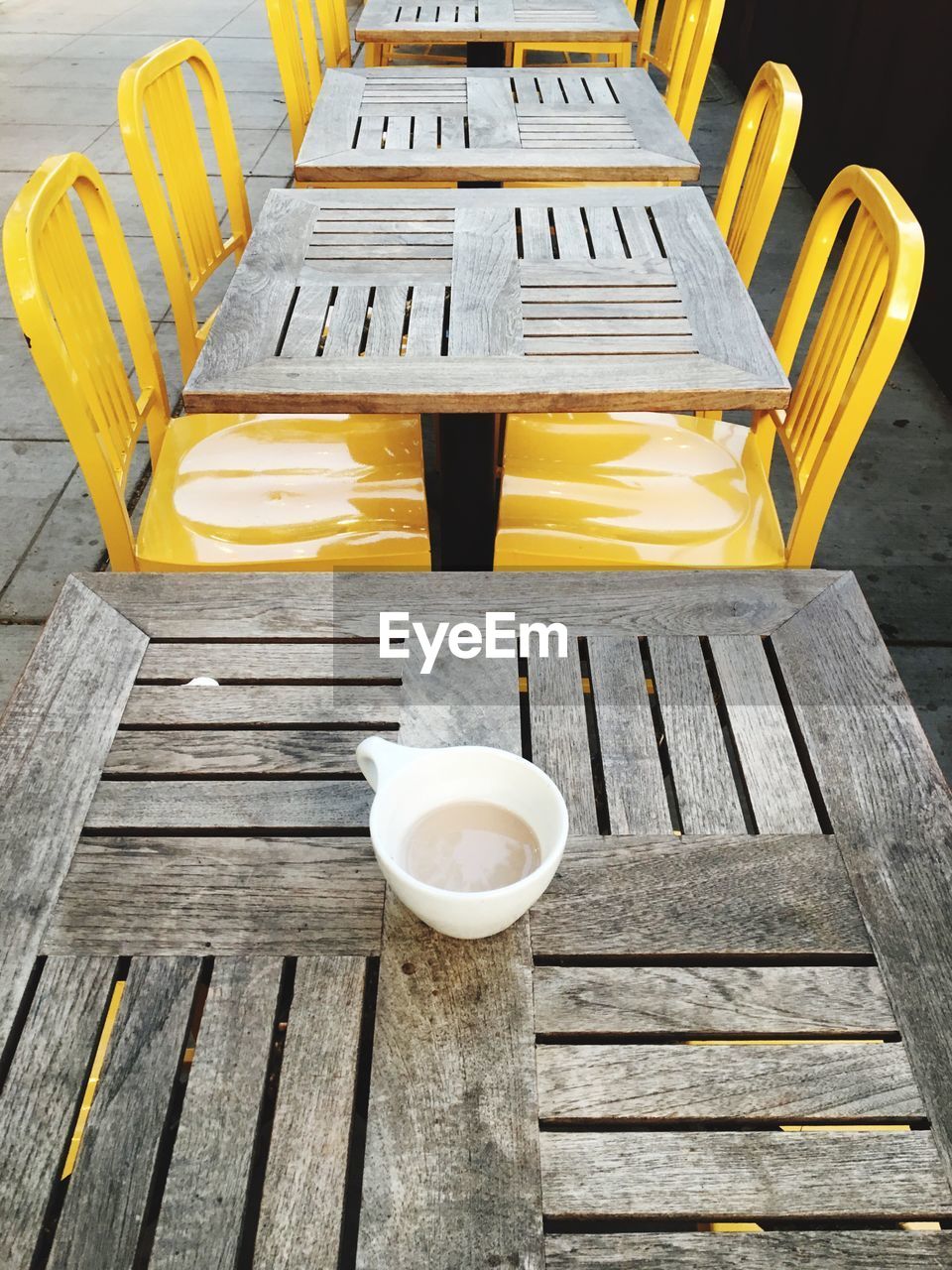 COFFEE CUP ON TABLE AND CHAIRS