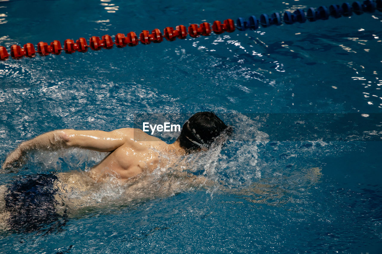 High angle view of swimming in pool