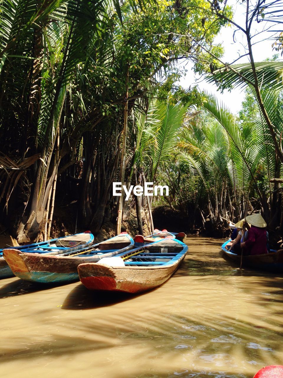 Boats moored on sea shore