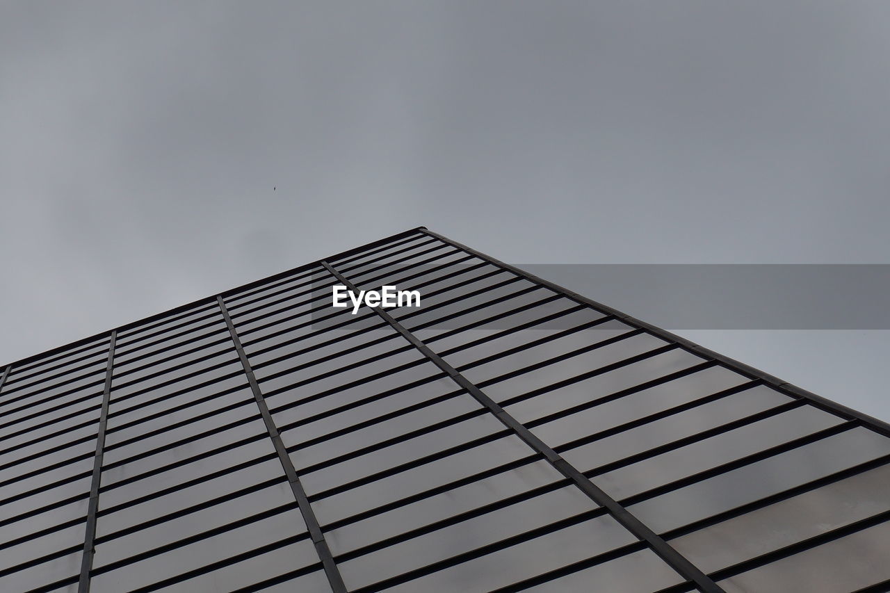 Low angle view of modern building against clear sky