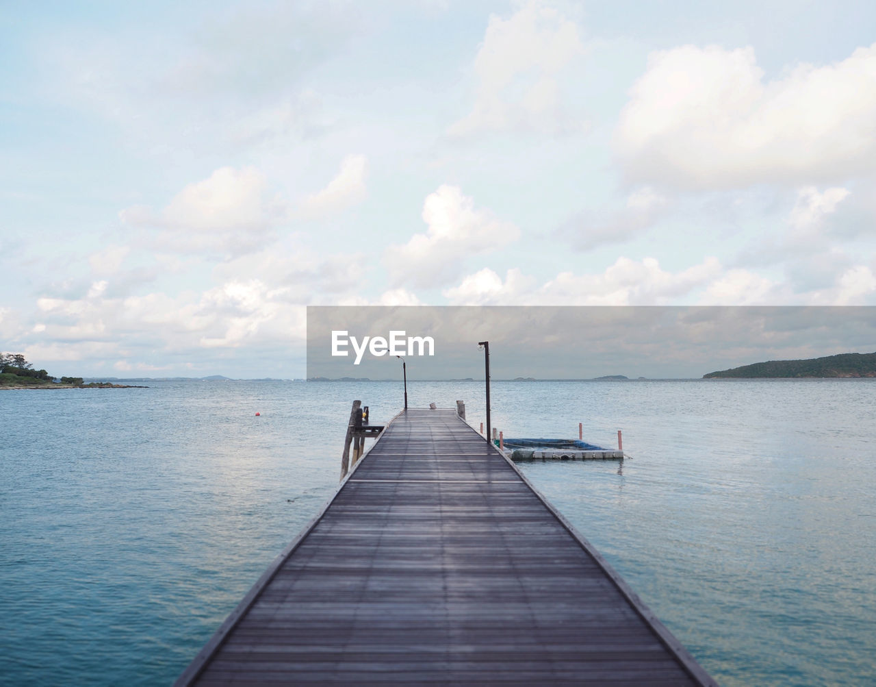 Pier over sea against sky