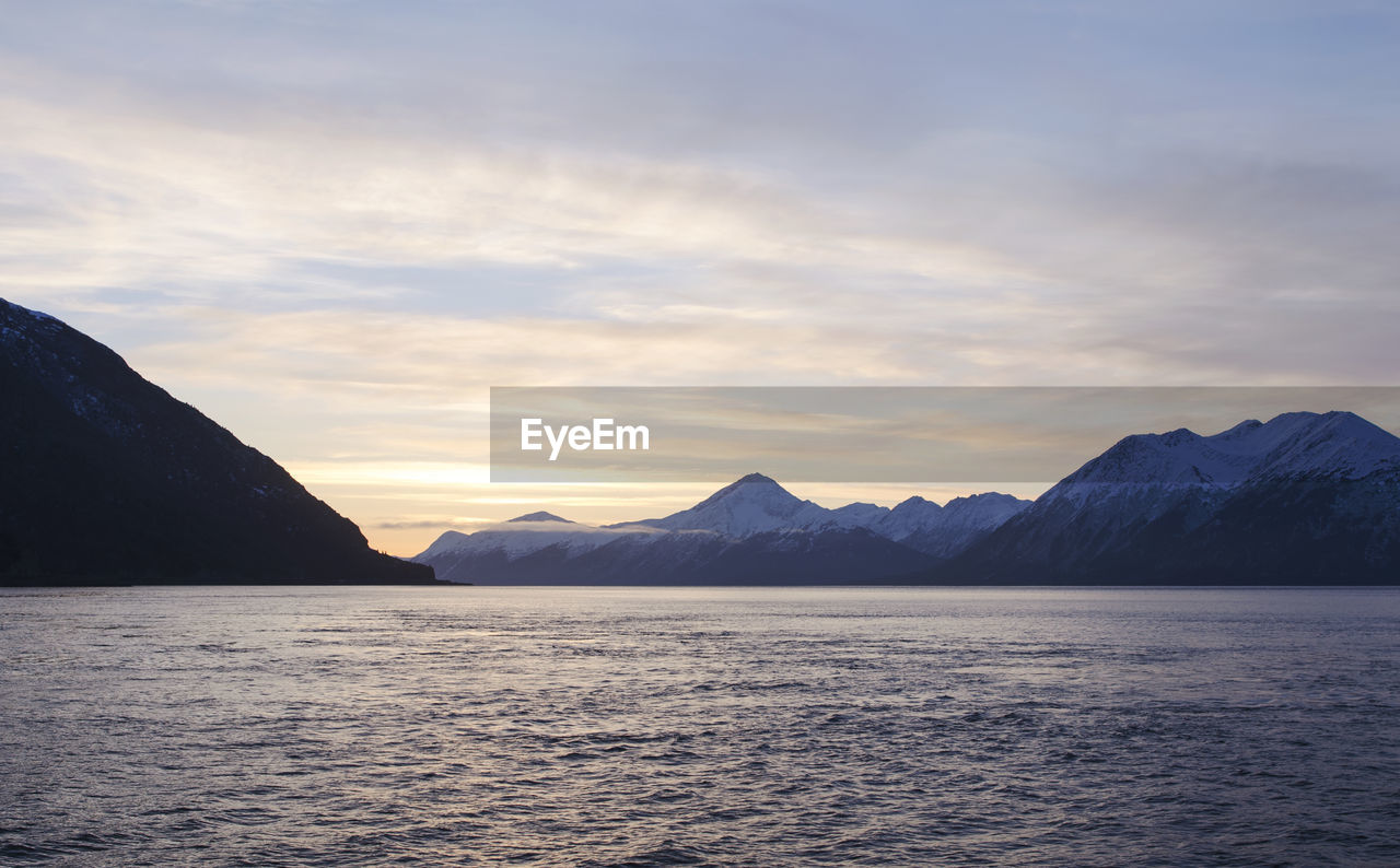 Scenic view of mountains against sky during sunset