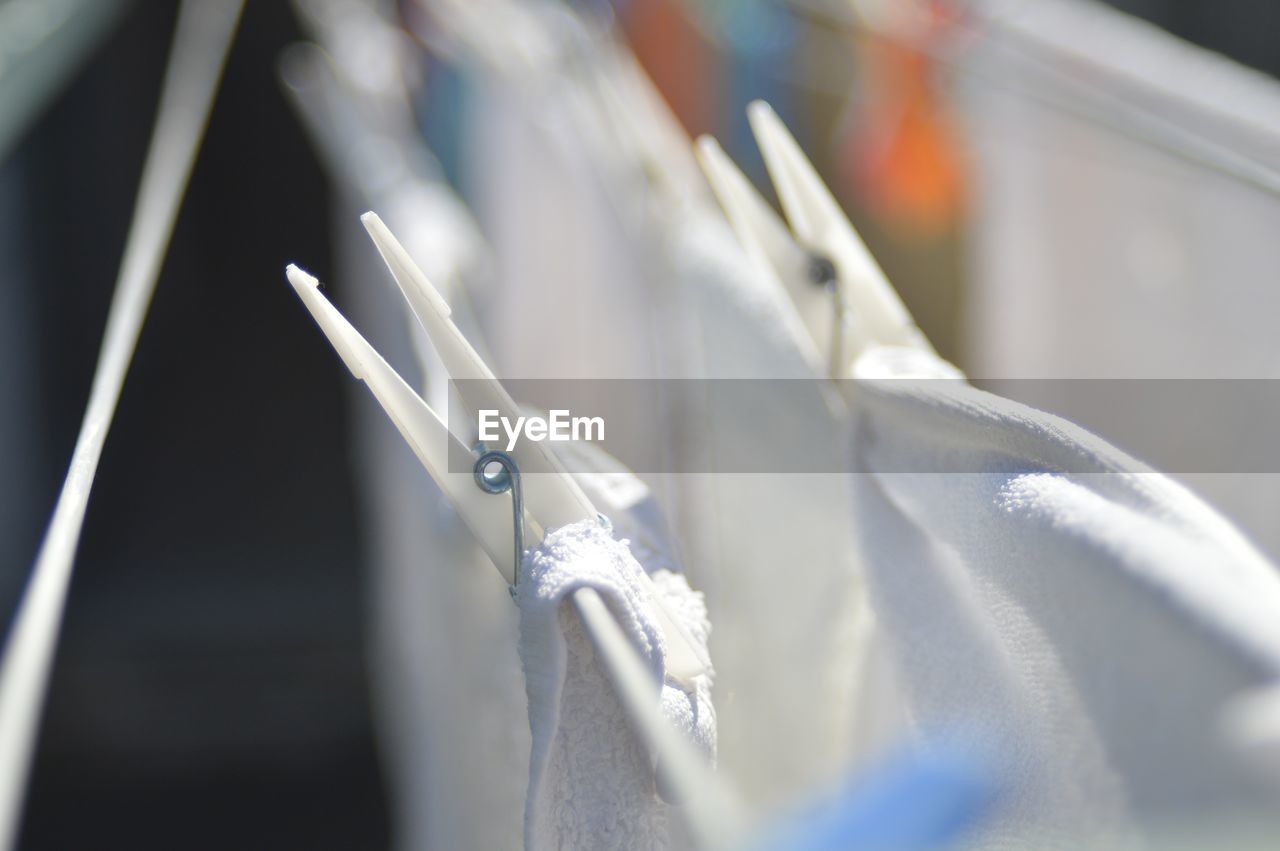 Close-up of towels drying on clothesline