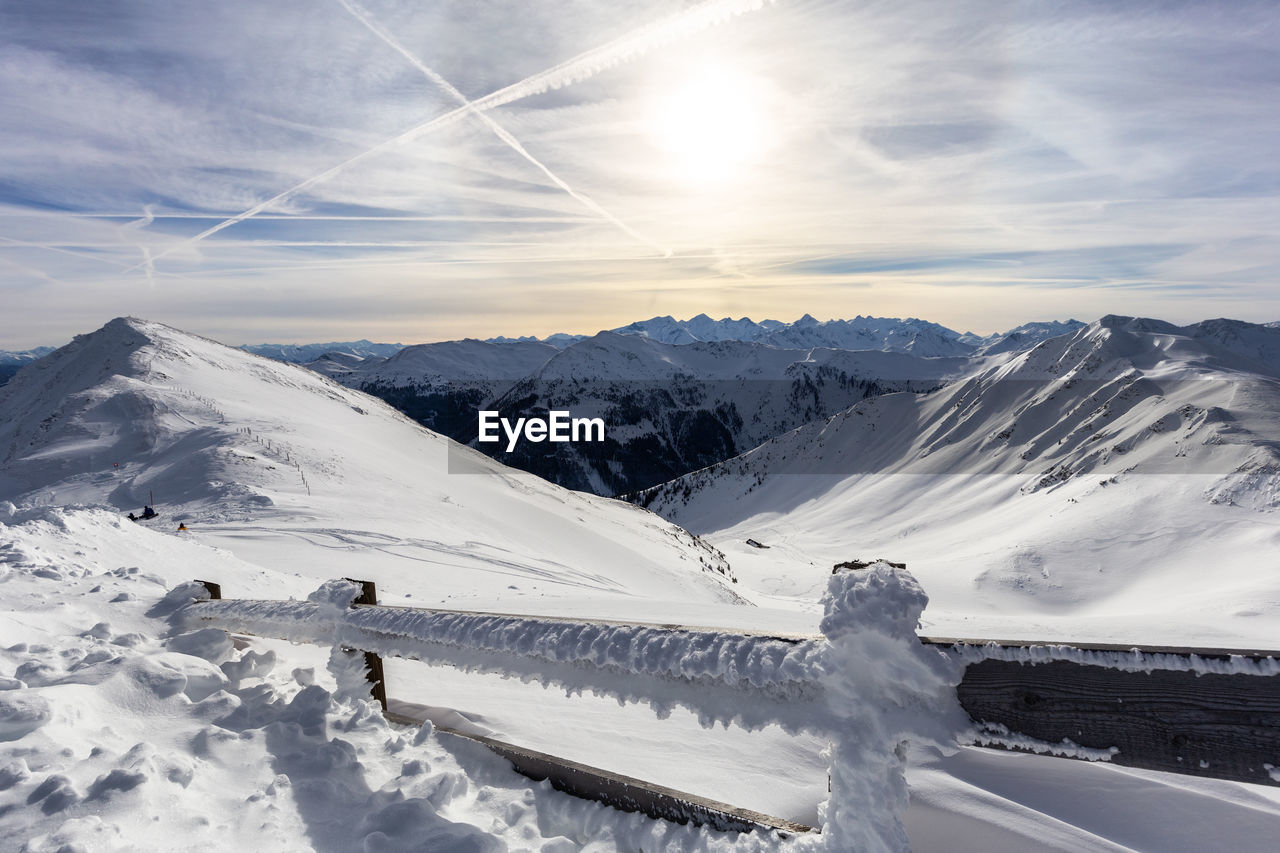 SNOW COVERED MOUNTAIN AGAINST SKY