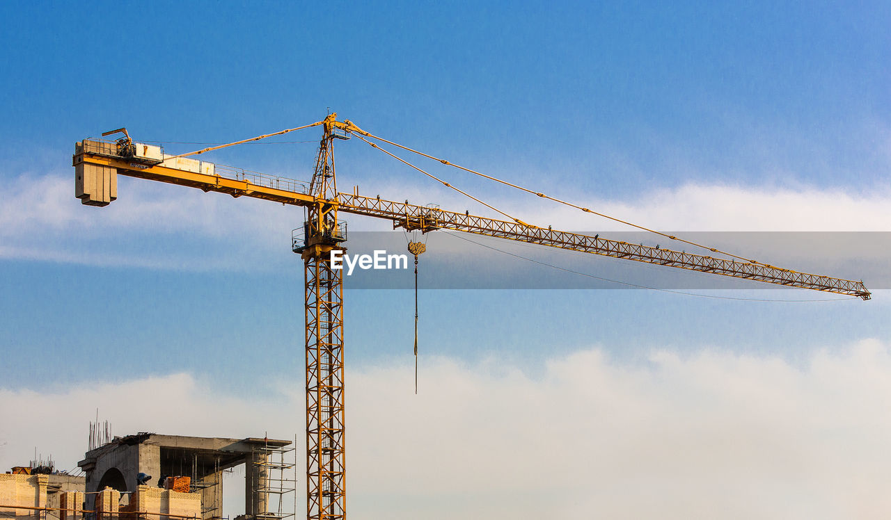 Crane on the sky background