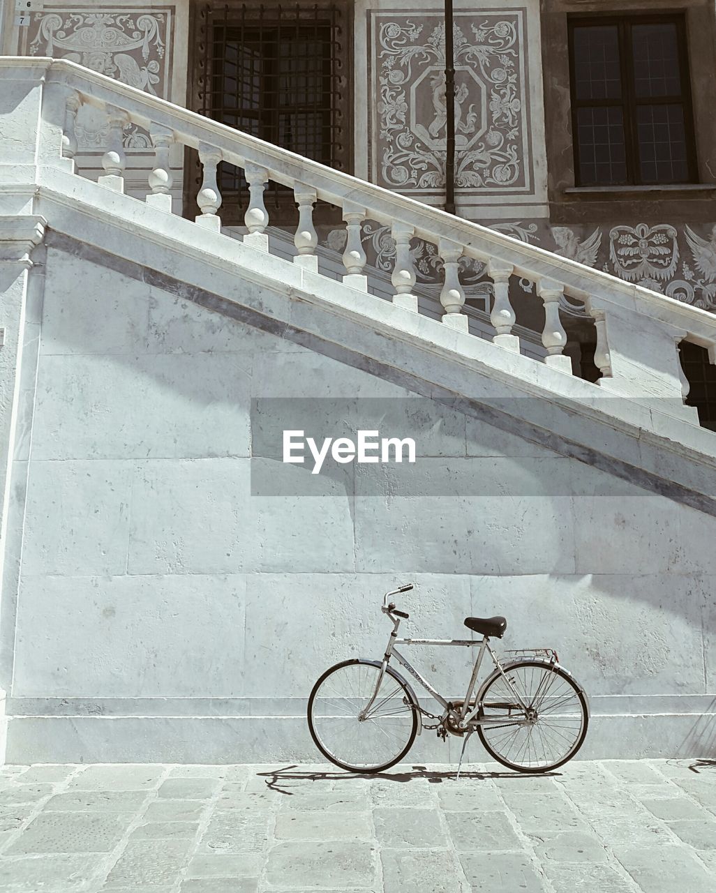 Bicycle parked in front of building