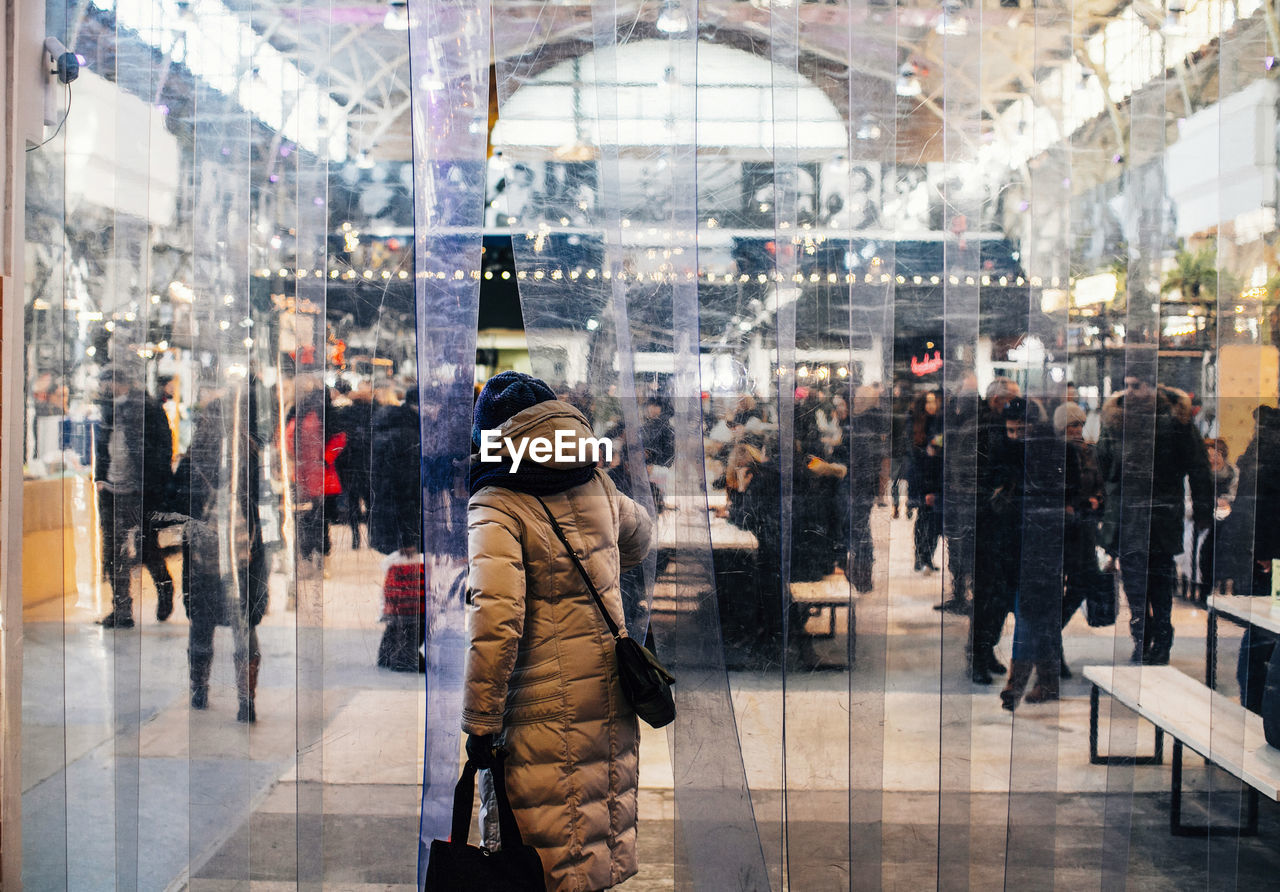 PEOPLE WALKING IN CITY AT STORE