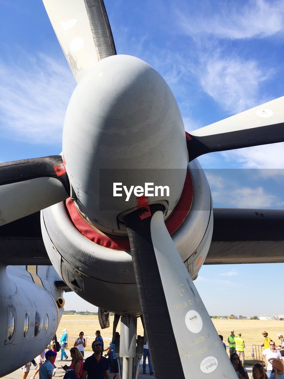 LOW ANGLE VIEW OF AIRPLANE AT AIRPORT AGAINST SKY