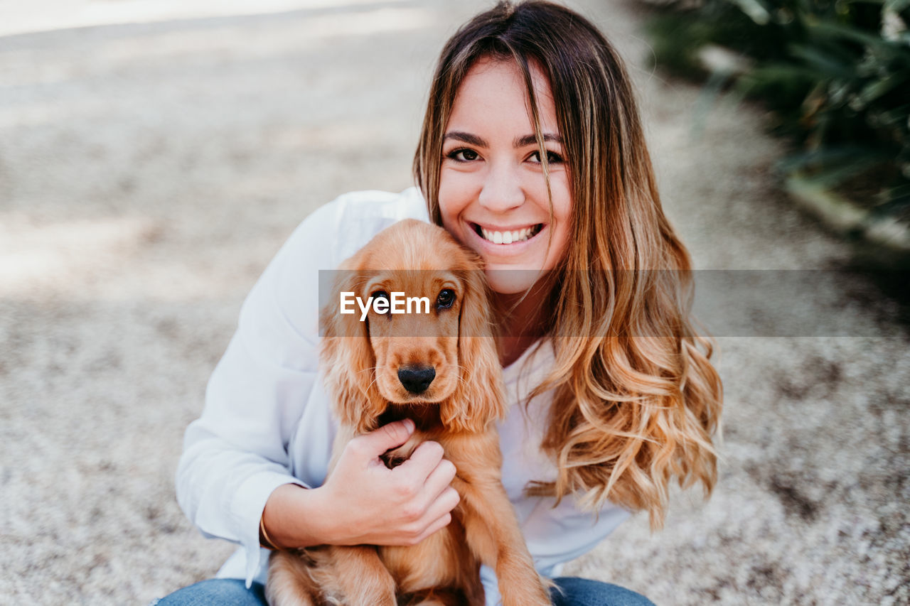 Woman with dog at park