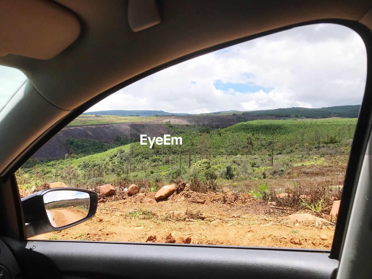 LANDSCAPE SEEN THROUGH CAR WINDSHIELD