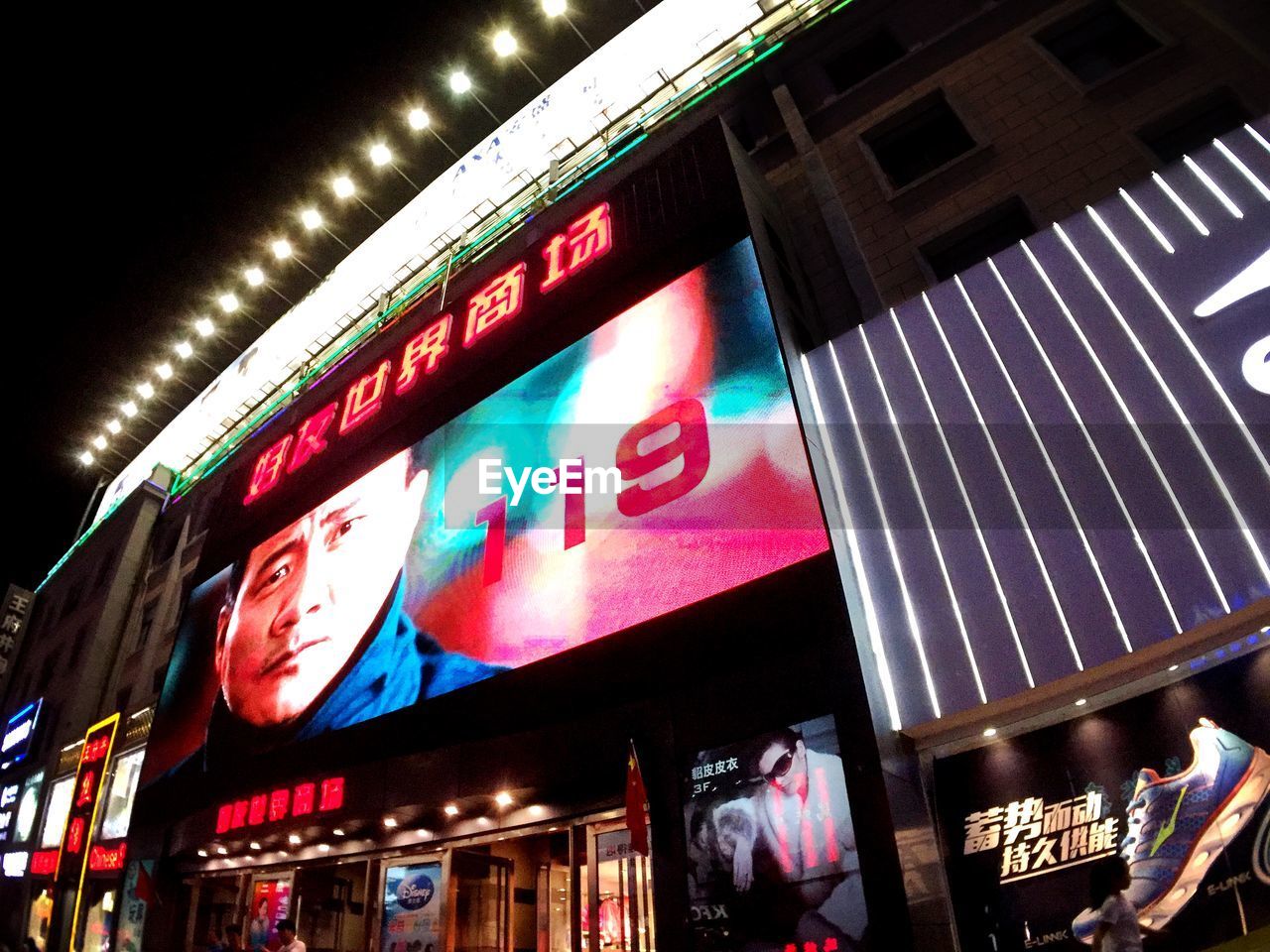 LOW ANGLE VIEW OF ILLUMINATED NEON SIGN