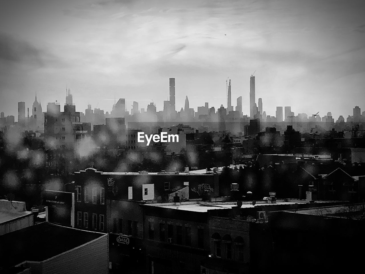 HIGH ANGLE VIEW OF BUILDINGS AGAINST SKY