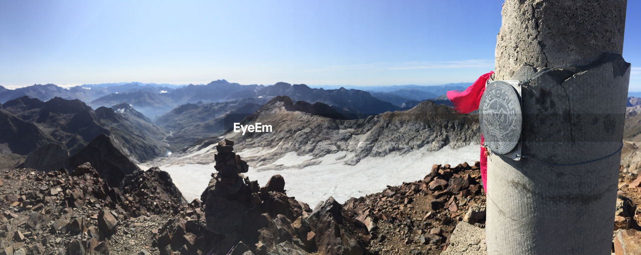 Panoramic view of mountains against blue sky