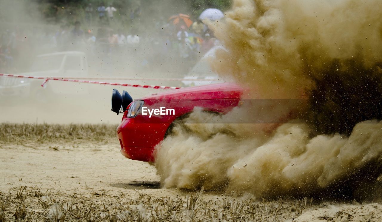 Smoke coming out of car during race