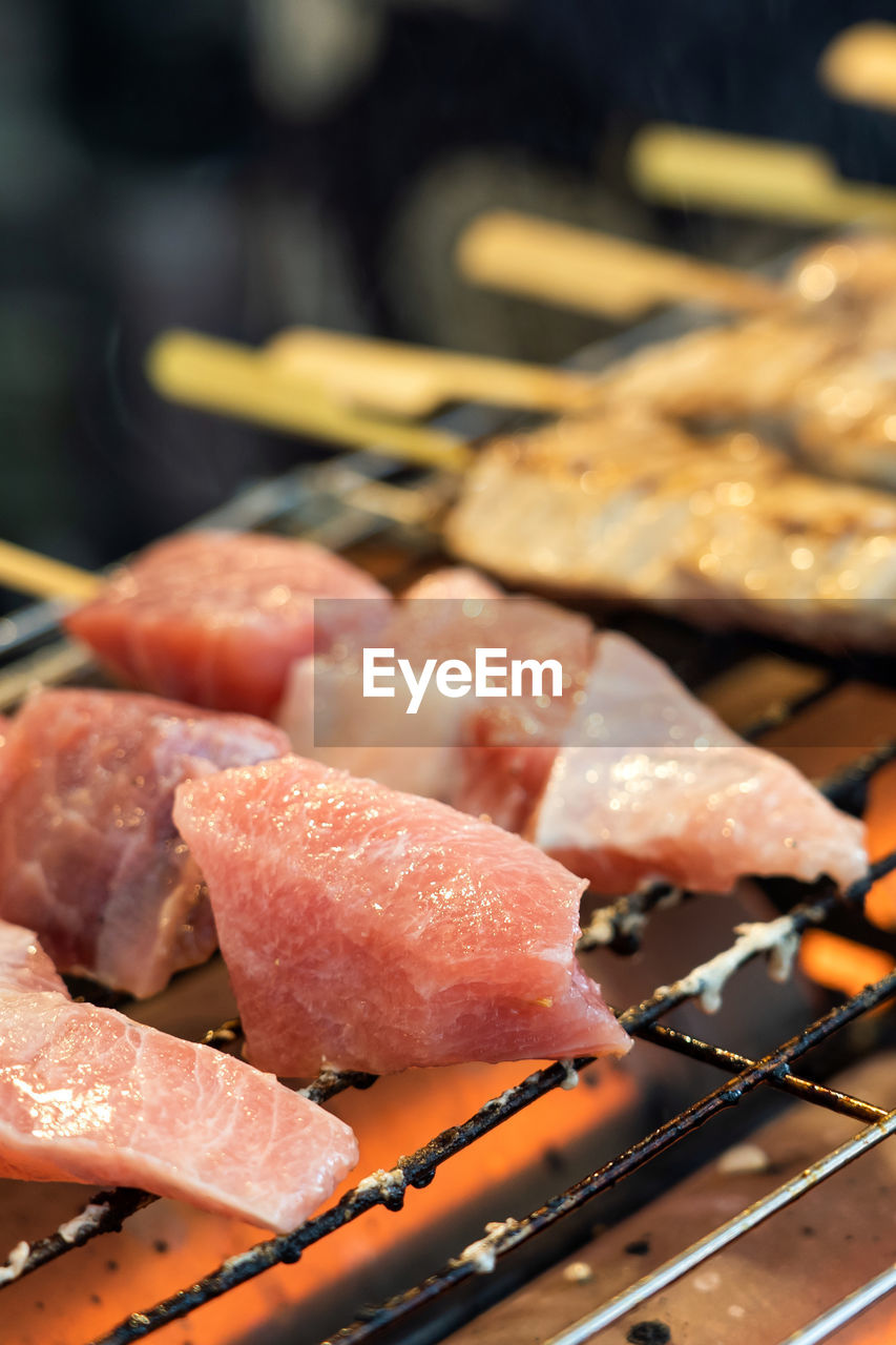 CLOSE-UP OF MEAT IN BARBECUE