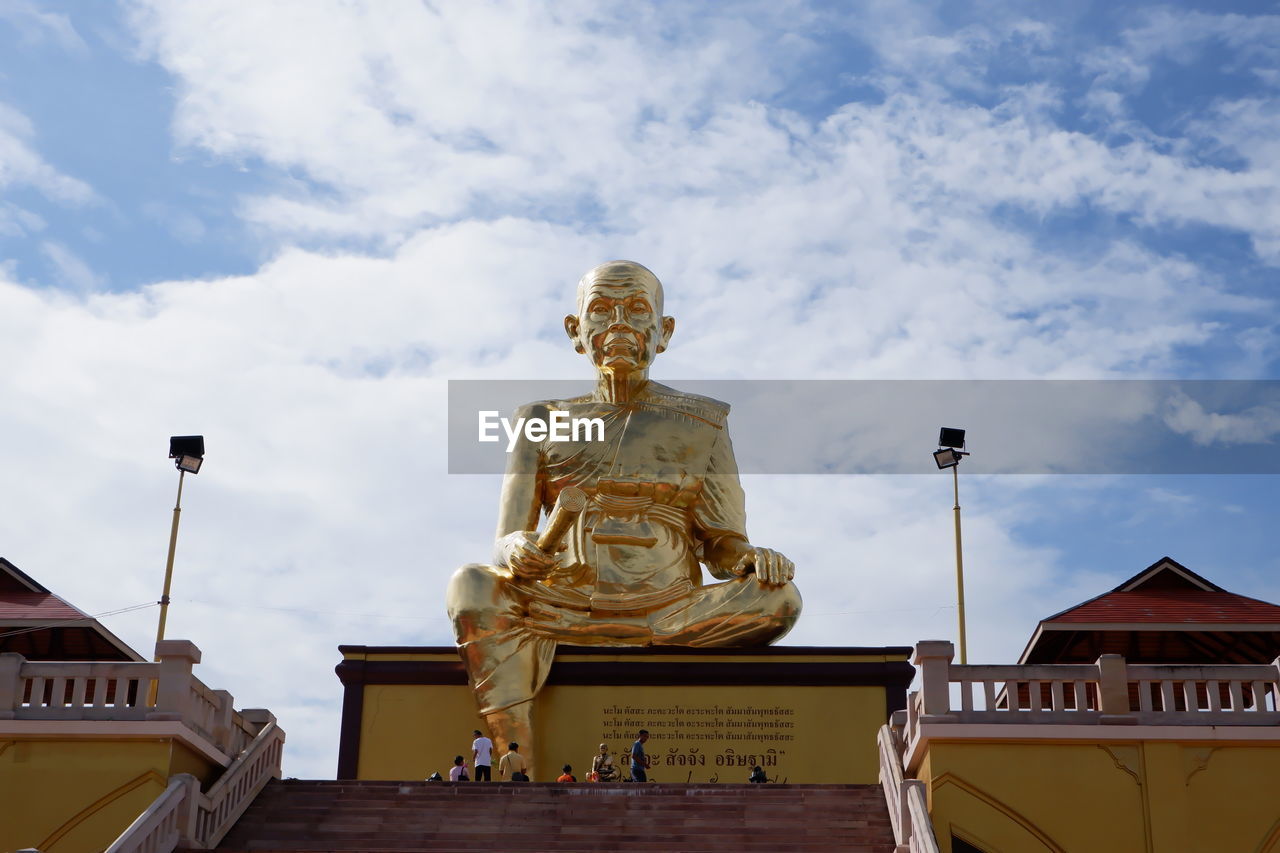 Low angle view of statue against sky