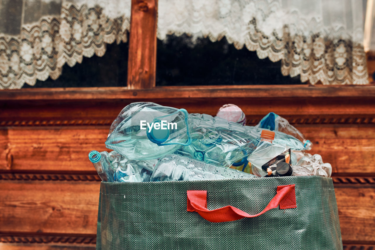 Plastic bottles collected in big container. heap of plastic bottles, cups, bags collected to recycle