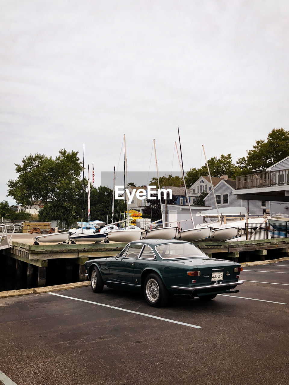 BOATS MOORED AT HARBOR