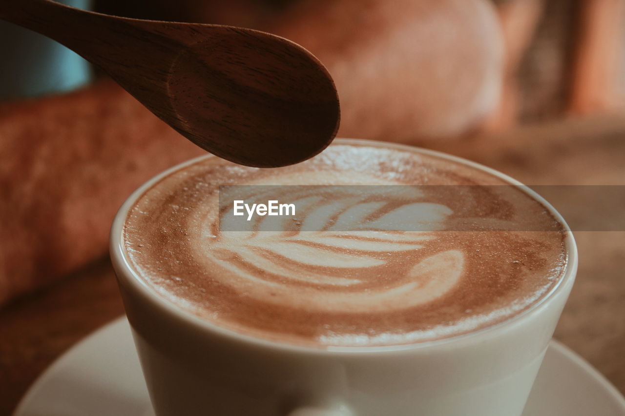 Close-up of cappuccino on table