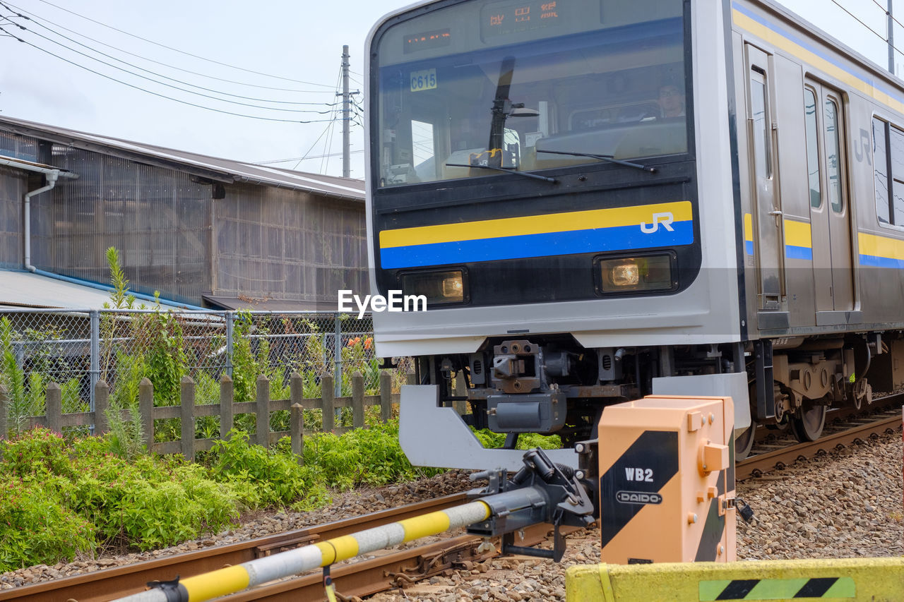 TRAIN AT RAILROAD STATION PLATFORM