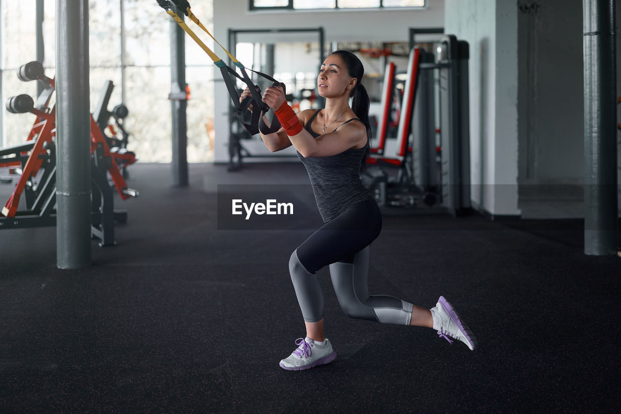 low section of woman exercising on road