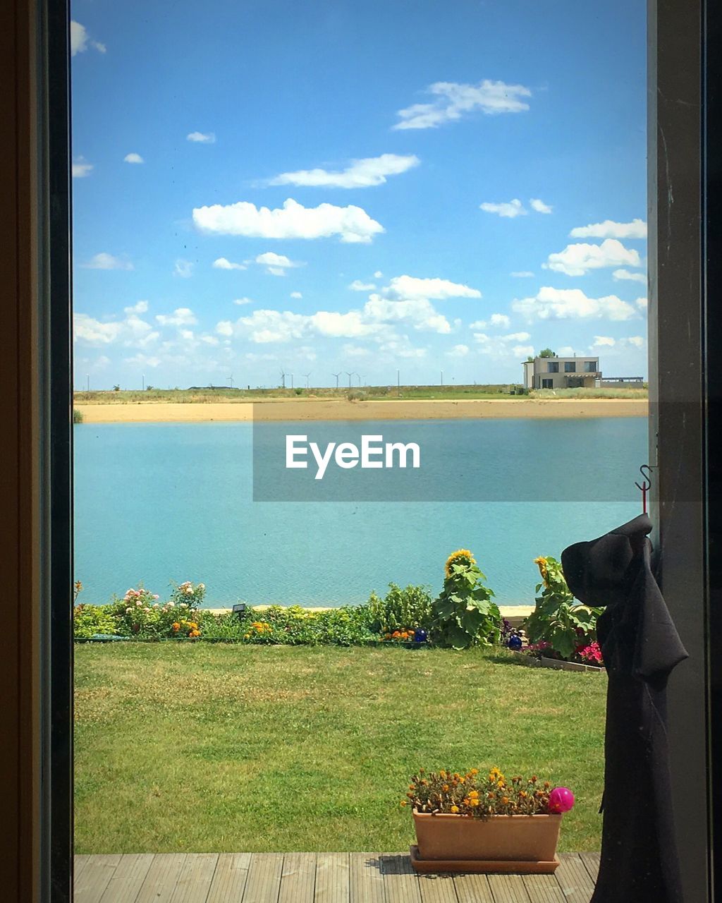 Scenic view of lake seen through window