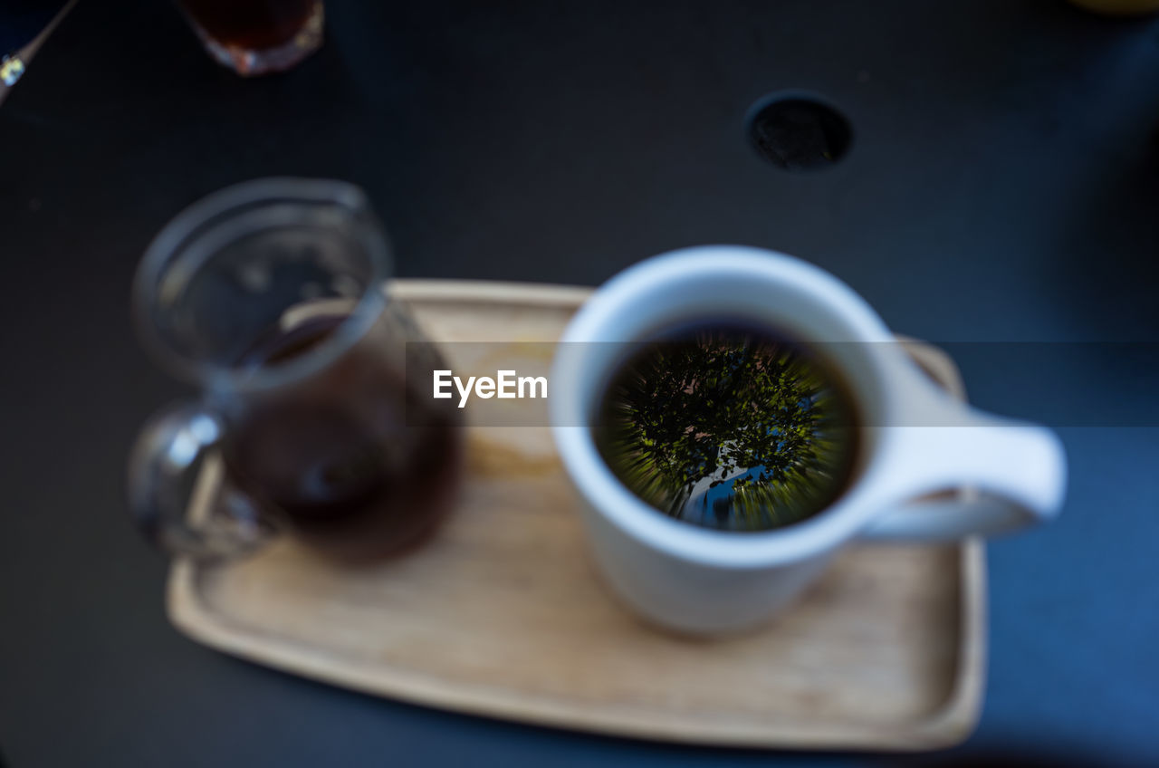 CLOSE-UP OF DRINK ON TABLE