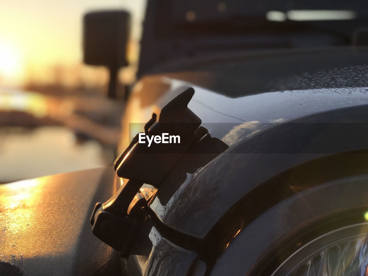 Close-up of car during sunset