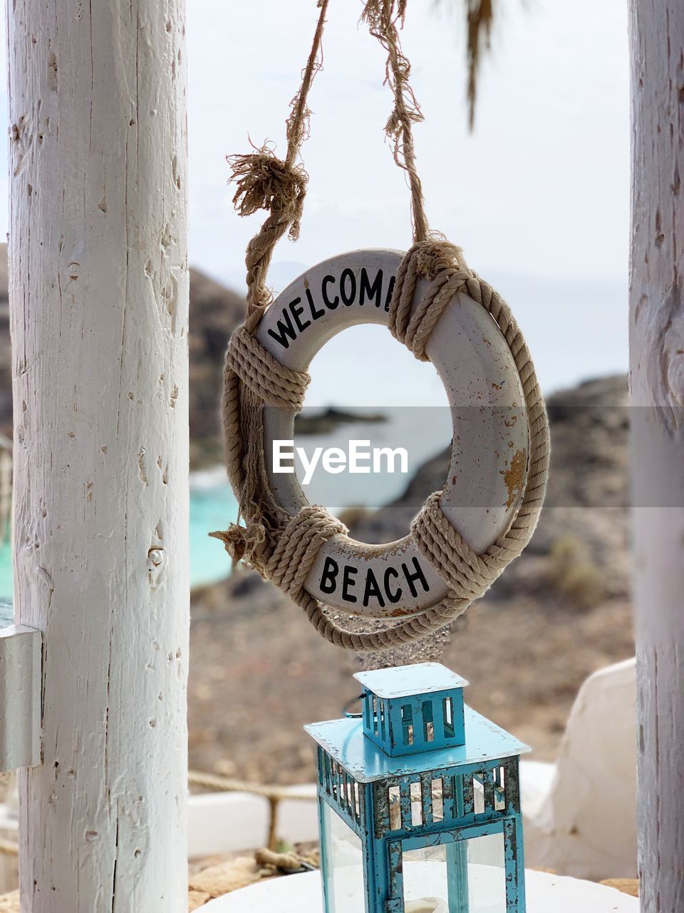 Close-up of welcome sign at beach