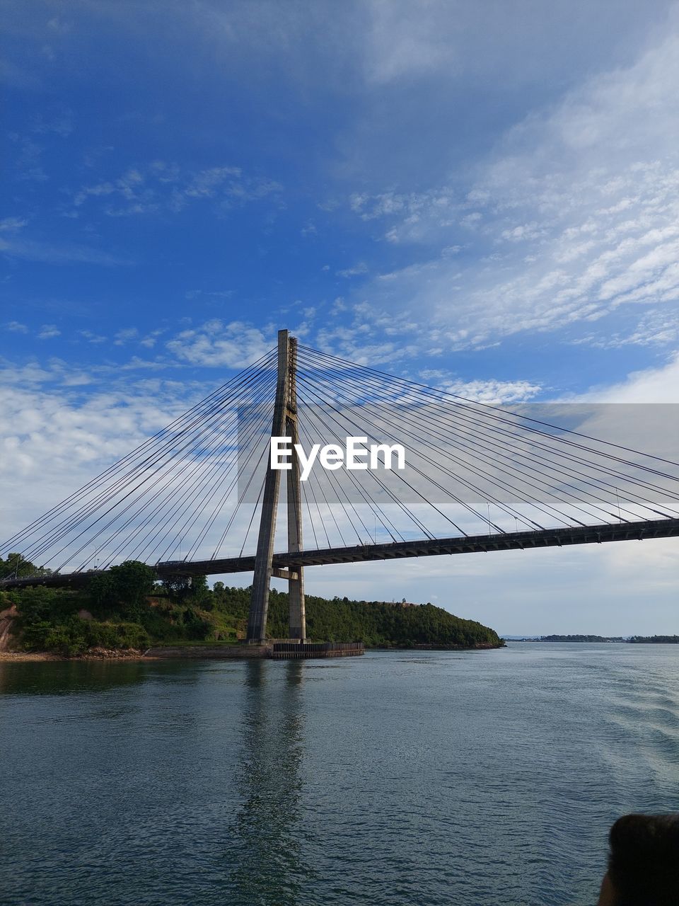 reflection, blue, water, sky, cloud, nature, sunlight, transportation, architecture, built structure, mast, no people, day, wind, sailing, outdoors, bridge, mode of transportation, nautical vessel, travel, line, sea, beauty in nature, suspension bridge