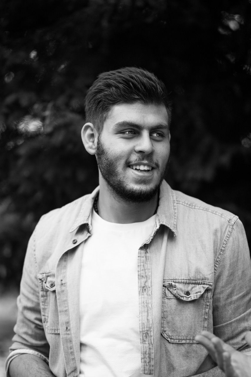 Young man smiling while looking away