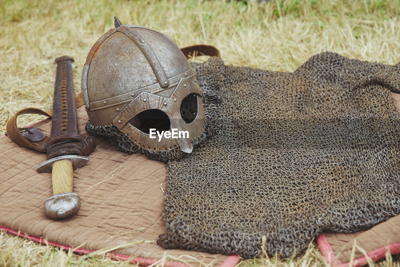 Old viking armor on yellowed grass. viking festival in denmark