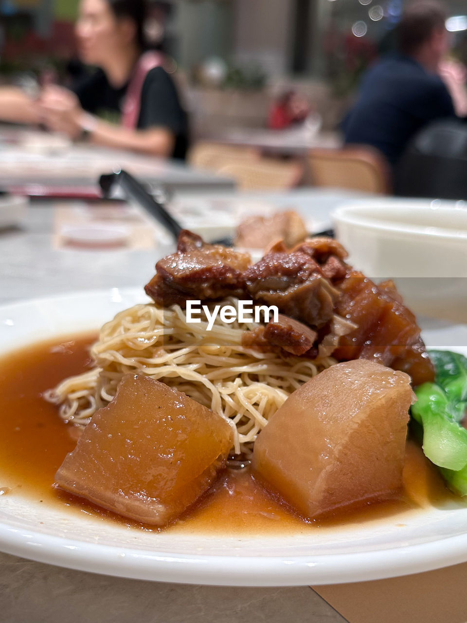 food and drink, food, dish, meal, cuisine, lunch, plate, restaurant, business, meat, focus on foreground, healthy eating, chinese food, table, asian food, indoors, pasta, dinner, freshness, breakfast, italian food, close-up, city