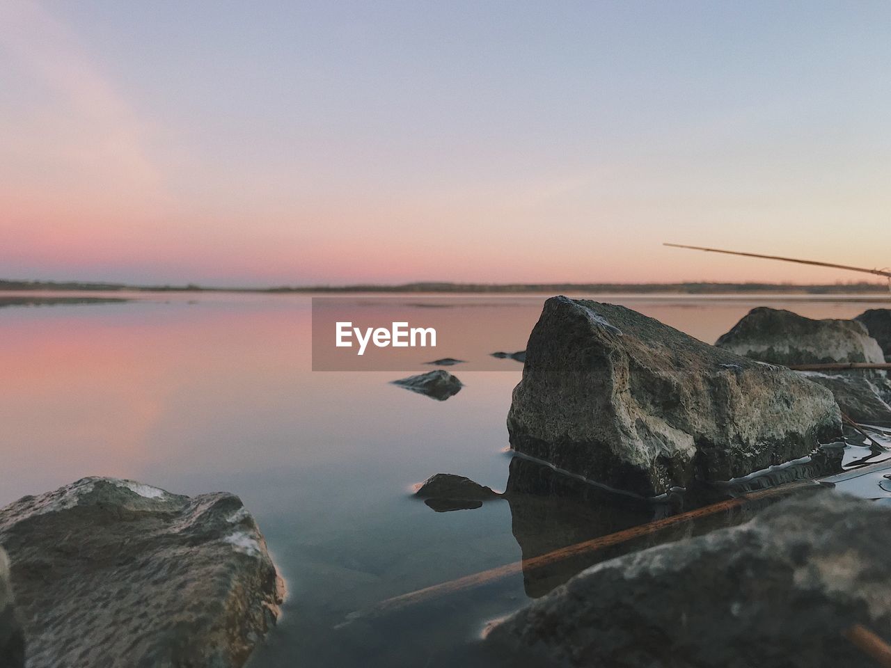 Scenic view of sea against sky at sunset