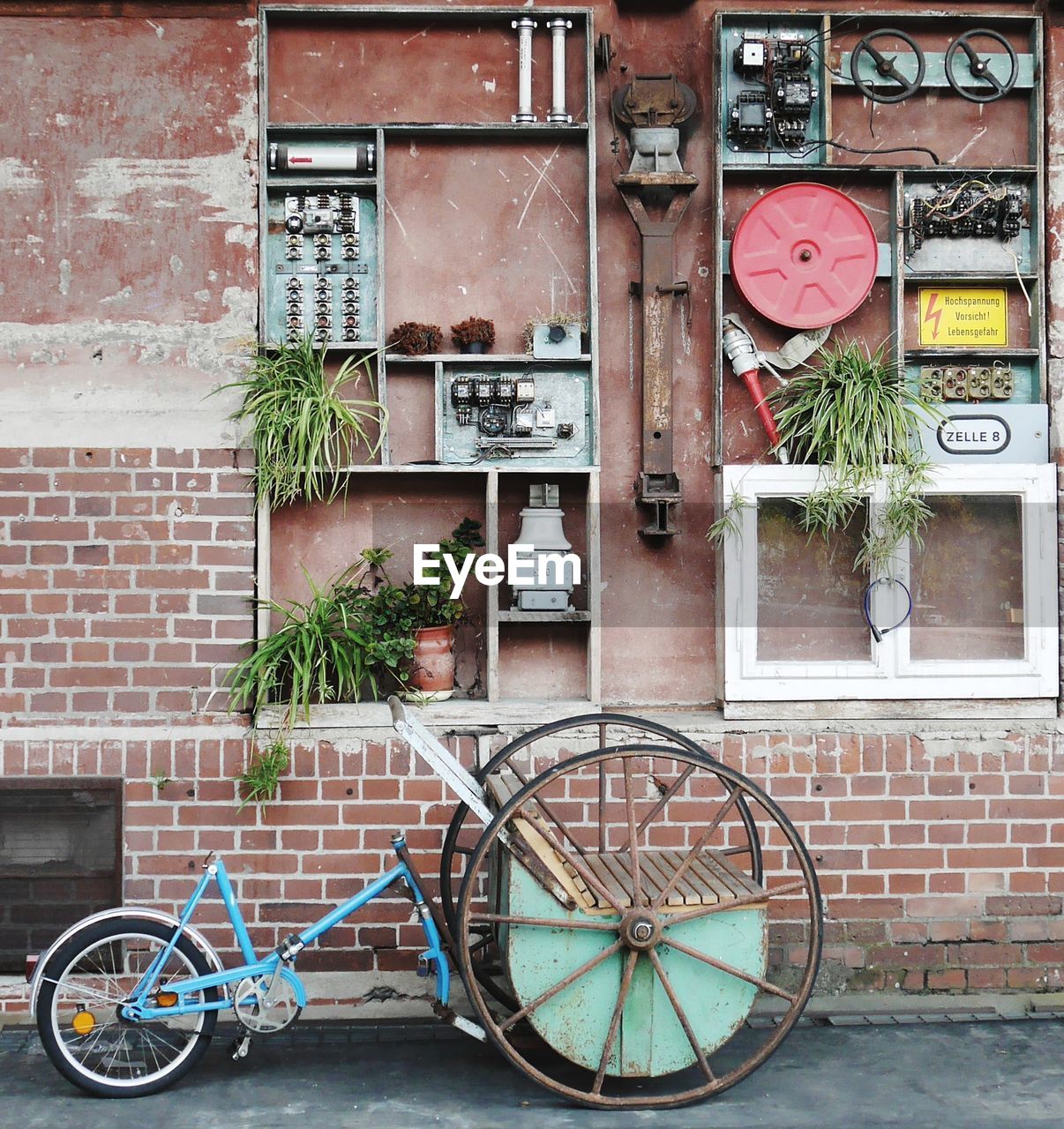 BICYCLE AGAINST BRICK WALL